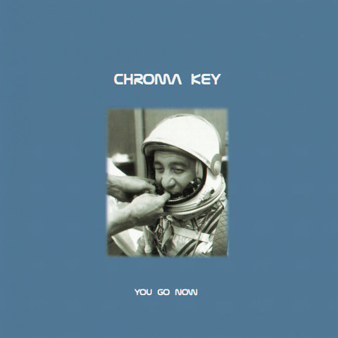 Album cover: An astronaut with someone off camera adjusting his helmet